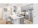 Modern kitchen with stainless steel appliances, island, and gray cabinets at 2700 Pine Tree Ne Rd # 2201, Atlanta, GA 30324