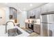 Modern kitchen with stainless steel appliances and a kitchen island at 2700 Pine Tree Ne Rd # 2201, Atlanta, GA 30324