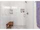 Modern shower with white subway tile, built-in niche, bench, and glass door at 2700 Pine Tree Ne Rd # 2201, Atlanta, GA 30324