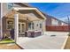 Covered patio with ceiling fan, comfortable seating, and a grill for outdoor entertaining at 332 Hinton Farm Way, Dacula, GA 30019