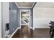 Entryway with hardwood floors, blue walls, white trim, and staircase to upper level at 332 Hinton Farm Way, Dacula, GA 30019