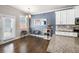 Well-lit dining area features modern decor near a kitchen with granite countertops and stainless appliances at 332 Hinton Farm Way, Dacula, GA 30019