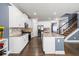 Modern kitchen with granite countertops, stainless steel appliances, and seamless flow into the dining area at 332 Hinton Farm Way, Dacula, GA 30019