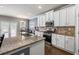 Modern kitchen featuring granite countertops, stainless steel appliances, and ample counter space at 332 Hinton Farm Way, Dacula, GA 30019