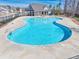 Community pool featuring a large swimming area, clubhouse, and well-maintained surroundings at 332 Hinton Farm Way, Dacula, GA 30019