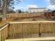 Backyard with a wood fence and building in the background at 4190 Haynes Mill Nw Ct, Kennesaw, GA 30144