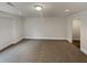 Finished basement area with neutral carpet and ample space for recreation at 4190 Haynes Mill Nw Ct, Kennesaw, GA 30144