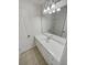 Bathroom featuring a long white vanity, large mirror, ample counter space, and tiled floor at 4190 Haynes Mill Nw Ct, Kennesaw, GA 30144