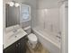 Clean and functional bathroom with shower-tub combo and vanity at 4190 Haynes Mill Nw Ct, Kennesaw, GA 30144