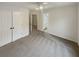 Spacious bedroom with ceiling fan, neutral carpet, closet and an en suite bathroom at 4190 Haynes Mill Nw Ct, Kennesaw, GA 30144