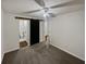 Bedroom with carpet and barn door to an attached bathroom at 4190 Haynes Mill Nw Ct, Kennesaw, GA 30144