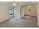 Bright bedroom with neutral carpet and multiple windows providing natural light at 4190 Haynes Mill Nw Ct, Kennesaw, GA 30144