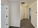 Bright hallway with neutral carpet and modern lighting fixtures, leading to various rooms at 4190 Haynes Mill Nw Ct, Kennesaw, GA 30144