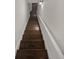 Staircase with wooden steps and white railing at 4190 Haynes Mill Nw Ct, Kennesaw, GA 30144