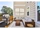 Outdoor back deck with gray wicker furniture and a stainless steel grill, perfect for outdoor dining and entertaining at 429 Stagecoach Bnd, Smyrna, GA 30080