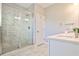 Modern bathroom featuring a sleek glass-enclosed shower and dual-sink vanity with quartz countertop at 429 Stagecoach Bnd, Smyrna, GA 30080