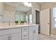 Bathroom features a double vanity, tiled floors, and an open doorway at 429 Stagecoach Bnd, Smyrna, GA 30080