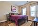 Comfortable bedroom with a large bed, stylish decor, and natural light from two windows at 429 Stagecoach Bnd, Smyrna, GA 30080