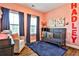 Charming Bedroom with a crib, accent rug, and cozy chair, creating a warm and inviting space at 429 Stagecoach Bnd, Smyrna, GA 30080
