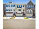 Attractive townhome row featuring brick and siding, with individual garages and landscaped front yards at 429 Stagecoach Bnd, Smyrna, GA 30080