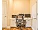 Functional home office setup with a spacious desk, multiple monitors, and ample storage space at 429 Stagecoach Bnd, Smyrna, GA 30080