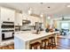 Well-equipped kitchen featuring an island with seating, stainless appliances, and open layout into living area at 429 Stagecoach Bnd, Smyrna, GA 30080