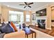 Comfortable living room featuring a fireplace, built-in shelving, and ample natural light at 429 Stagecoach Bnd, Smyrna, GA 30080