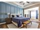 Main bedroom featuring a paneled accent wall, en-suite bathroom access, and hardwood floors at 429 Stagecoach Bnd, Smyrna, GA 30080