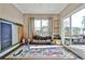 Bright playroom with large windows, a playful rug, and easy access to the outdoor deck at 429 Stagecoach Bnd, Smyrna, GA 30080
