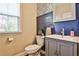 Stylish powder room with gray vanity, modern fixtures, and chic wall accents at 429 Stagecoach Bnd, Smyrna, GA 30080