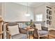 Cozy sitting area with comfortable armchairs, accent pillows, and decorative wall hangings at 429 Stagecoach Bnd, Smyrna, GA 30080