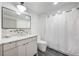 Modern bathroom featuring a sleek vanity, contemporary fixtures, and a shower with a clean white shower curtain at 726 Edgewood Ne Ave, Atlanta, GA 30307