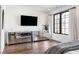 Bright bedroom showcasing mirrored dressers and a large window with decorative curtains at 726 Edgewood Ne Ave, Atlanta, GA 30307