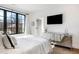 Bright bedroom featuring sleek, mirrored dresser, and floor to ceiling window at 726 Edgewood Ne Ave, Atlanta, GA 30307