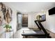 Fully-equipped home gym features a treadmill, mirrored wall, and access to the outside patio at 726 Edgewood Ne Ave, Atlanta, GA 30307