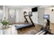 Well-equipped home gym featuring a treadmill, rowing machine, and other fitness equipment at 726 Edgewood Ne Ave, Atlanta, GA 30307