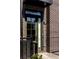 Close up of the home's front door with brick, black trim and an address plaque at 726 Edgewood Ne Ave, Atlanta, GA 30307