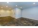 Unfinished basement with recessed lights and neutral walls with slate tile flooring at 80 Adrian Pl, Atlanta, GA 30327