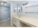 Clean, vintage bathroom with a long vanity and a view to the toilet and shower at 80 Adrian Pl, Atlanta, GA 30327