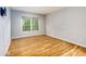 Inviting bedroom featuring wood floors, natural light from a window and neutral wall color at 80 Adrian Pl, Atlanta, GA 30327