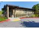 Cross Creek clubhouse exterior featuring a ramp, stone facade, and ample parking at 80 Adrian Pl, Atlanta, GA 30327