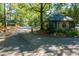 Cross Creek community entrance with landscaping, a guard house and a gate at 80 Adrian Pl, Atlanta, GA 30327