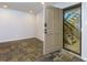 Entryway with tile flooring, a front door with a combination lock, and a view of stairs at 80 Adrian Pl, Atlanta, GA 30327