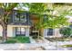 Well-maintained two-story condo building with tidy landscaping, a stairway and black shutters at 80 Adrian Pl, Atlanta, GA 30327