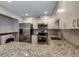 Bright kitchen with stainless steel appliances, white cabinets, and granite countertops at 80 Adrian Pl, Atlanta, GA 30327