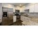 Modern kitchen featuring stainless steel appliances, white cabinets, and granite countertops at 80 Adrian Pl, Atlanta, GA 30327