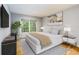 Serene main bedroom with a comfortable bed, stylish furnishings, and a large window at 80 Adrian Pl, Atlanta, GA 30327