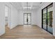 Bright, airy dining room featuring a modern light fixture and floor to ceiling glass at 819 Loridans Ne Dr, Atlanta, GA 30342