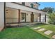 Charming front porch with stone pavers, wooden support columns and contemporary railings at 819 Loridans Ne Dr, Atlanta, GA 30342