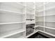 Well-organized walk-in pantry with custom shelving and stylish herringbone floors at 819 Loridans Ne Dr, Atlanta, GA 30342